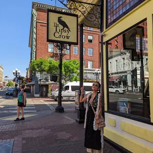 a woman standing in front of a store