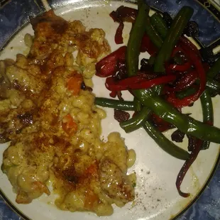 Blackend catfish on a bed of cajun white beans and  sauted greenbeans and red peppers w/ applewood smoked bacon crumbles