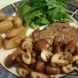 Black pepper and red wine marinated steak w sauted criminis and tourne fingerlings with organic mixed greens w sesame vinegrette
