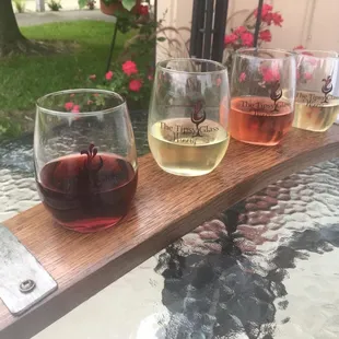 4-Wine flights. Four 1/2 size pours:$10 Smaller 6-wine sample flights are $5. Our flight boards are custom made from wine barrel staves.