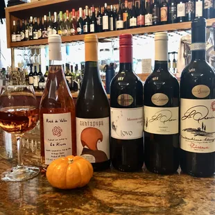 a variety of wines on a bar