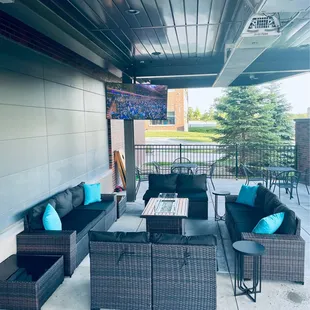 a patio with wicker furniture