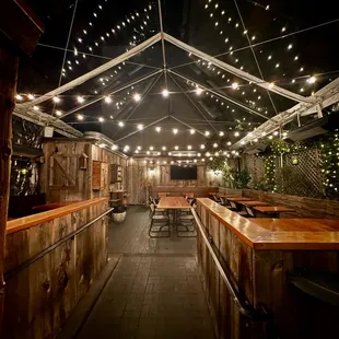 an outdoor bar with string lights