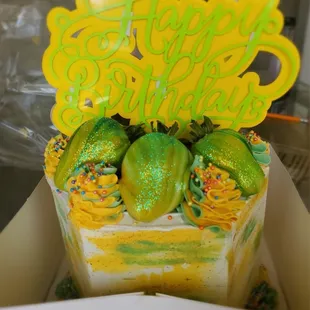 The coolest 3 tier cake topped with strawberries