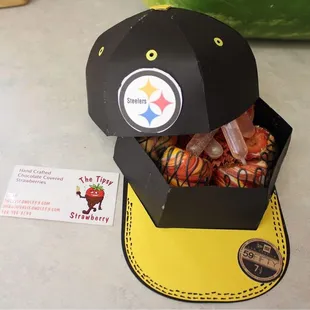 a pittsburgh football cap and a pickle