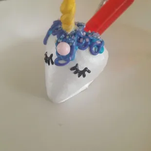 The little red tube is holding alcohol to drunken the strawberry