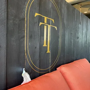 the logo on the wall
