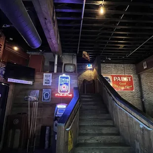 a man riding a skateboard down a flight of stairs
