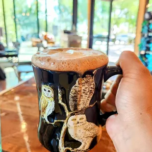 a person holding a coffee mug