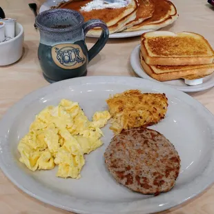 Eggs, sausage, hash browns and sourdough toast.