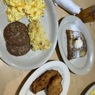 Sausage patty with eggs and cheese hash browns with a side of chicken tenders and French Toast(1pc)