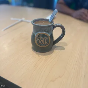 a cup of coffee on a table