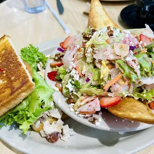 Half chicken salad sandwich and supposedly half strawberry fields salad