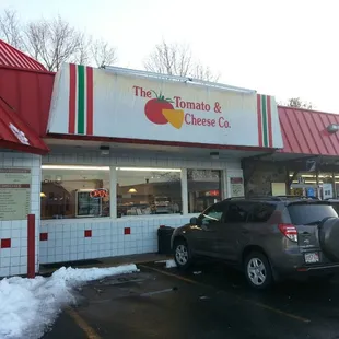 cars parked in front of the restaurant