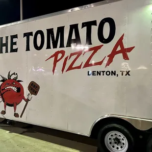 a delivery truck parked in a parking lot