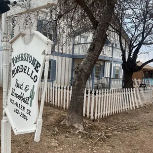 The sign and front door.