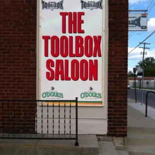 a sign for the toolbox saloon