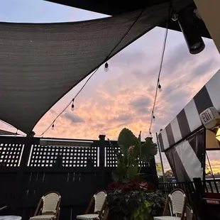 a patio with tables and chairs