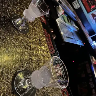 two empty glasses on the bar