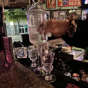 a bartender pouring a drink