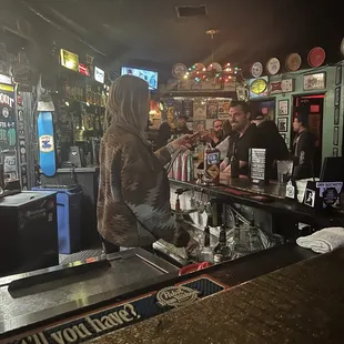 Christina behind the bar