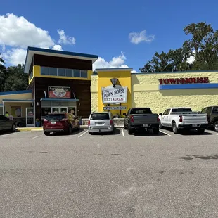 cars parked in front of the restaurant