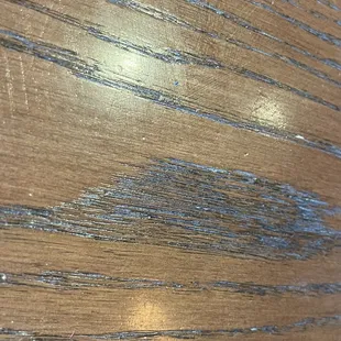 A table that once had crayon that I didn't detail wood crevices.