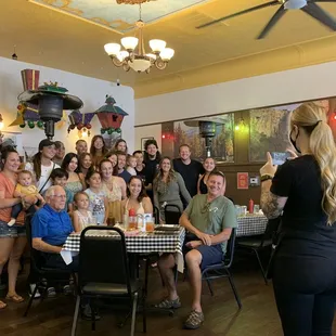 They do it all here! After serving a large party, the server was their photographer, too!
