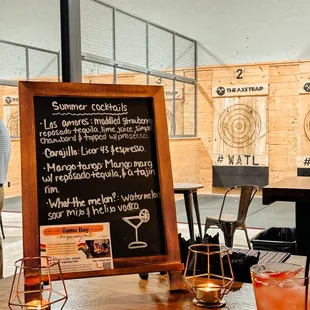 a table with drinks and a menu