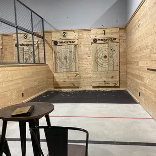 an indoor shooting range with targets