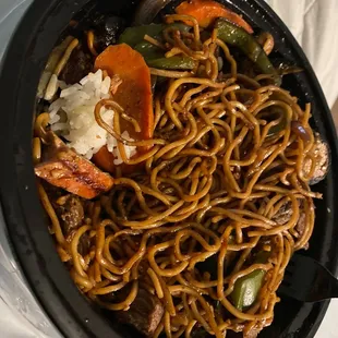 a bowl of noodles and vegetables