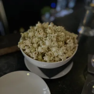 a bowl of popcorn on a table
