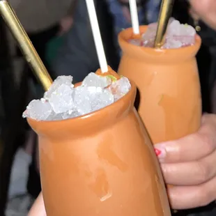 a close up of two glasses of drinks