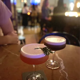 two cocktails on a table