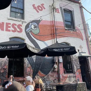 a mural of a bird on the side of a building