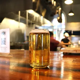 a pint of beer on a bar