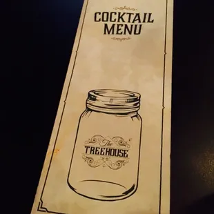 a cocktail menu on a table