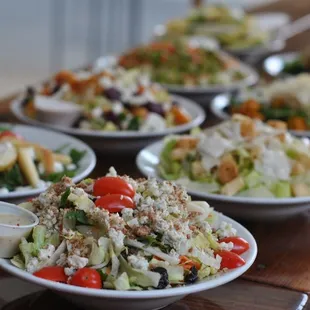 a variety of salads on plates