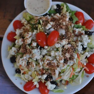 a plate of salad with dressing