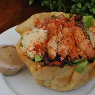 a chicken salad in a basket