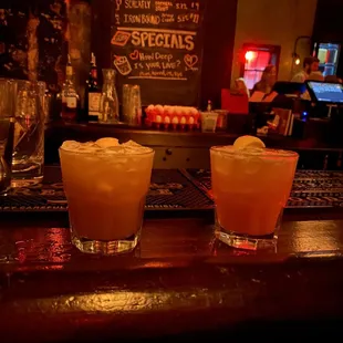 2 whiskey sours at the bar