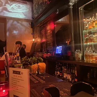 a bar with a lot of bottles of alcohol