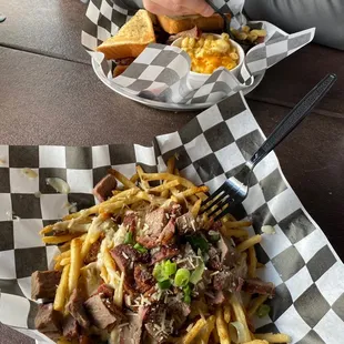 a plate of fries and a basket of meat