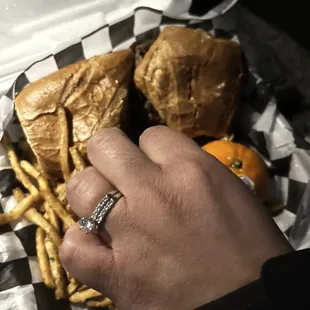 My wife photo bombing my shot trying to be fast because the garlic fries are too good to wait for!