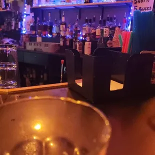 a glass of water on a bar