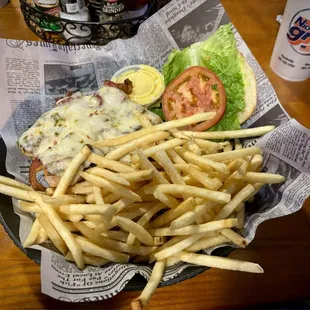 Blackjack specialty sandwich (blackened chicken, bacon, and pepper jack cheese) with fries at theTriple Nickel Grill in Mandeville.