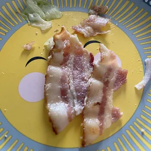 Raw bacon from the club sandwich.