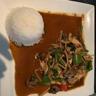 a plate of food with rice and vegetables