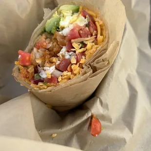 Scrambled egg burrito with potatoes he could dial cheddar cheese and avocado