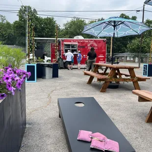 a picnic area with tables and umbrellas